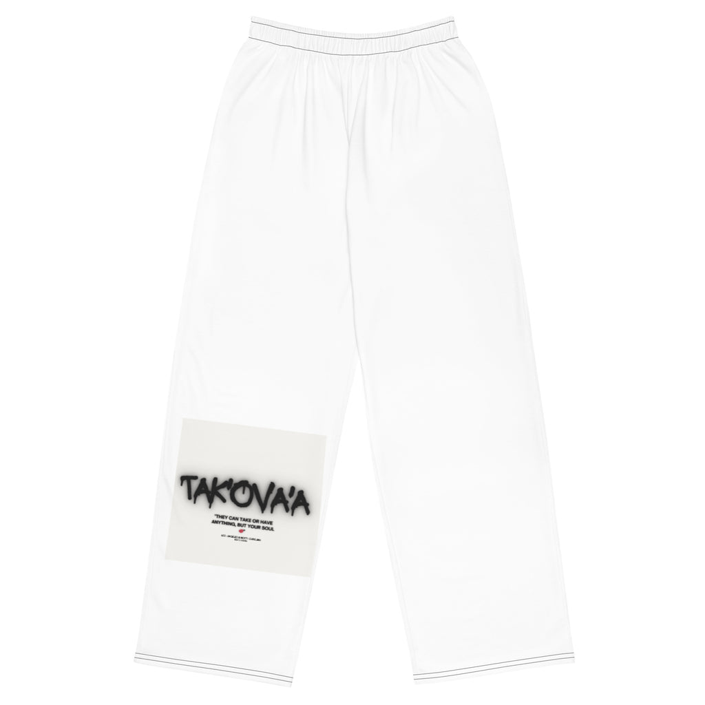 White pants with a patch featuring 'Takovaa' branding on a white background