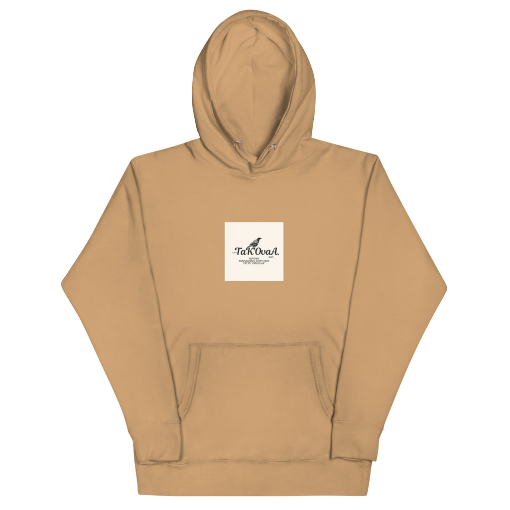 Tan hoodie with a logo on the chest against a white background