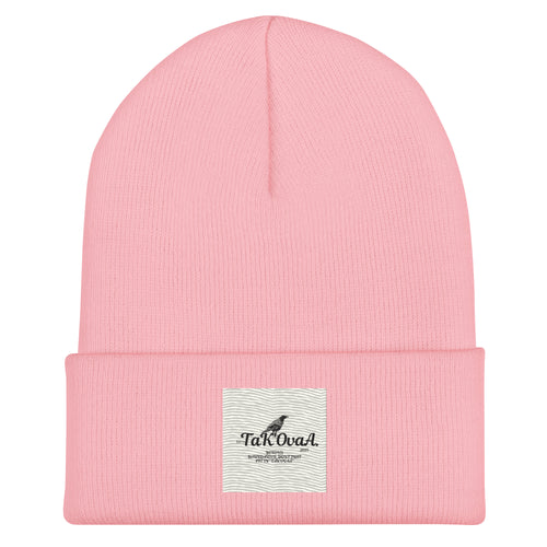 Pink beanie with a label on a white background