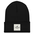 Black beanie with a white label on a white background