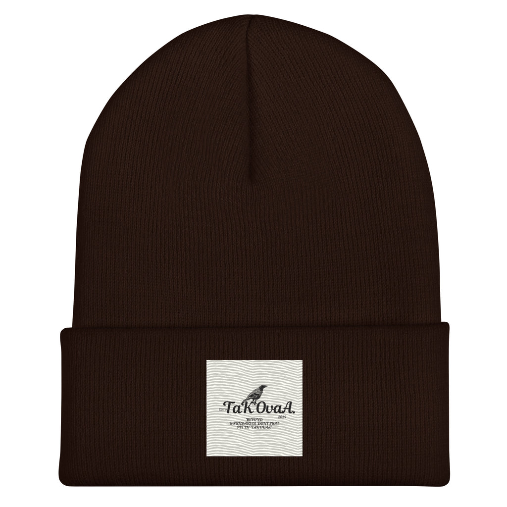 Brown beanie with a white label on a white background