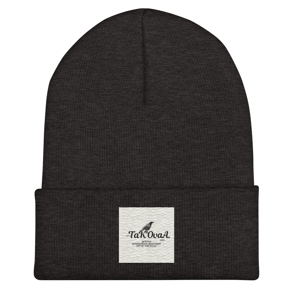 Black beanie with a white label on a white background