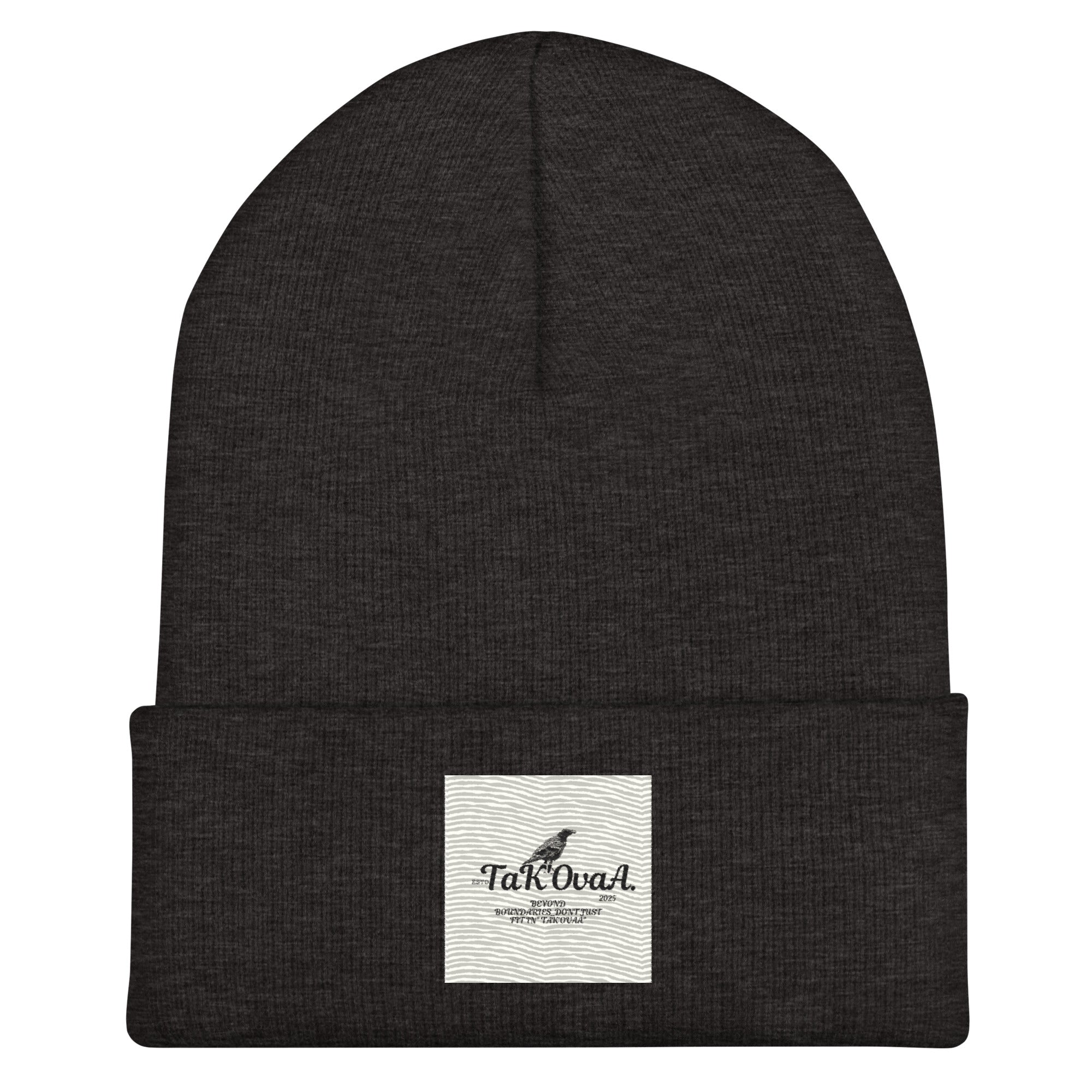Black beanie with a white label on a white background