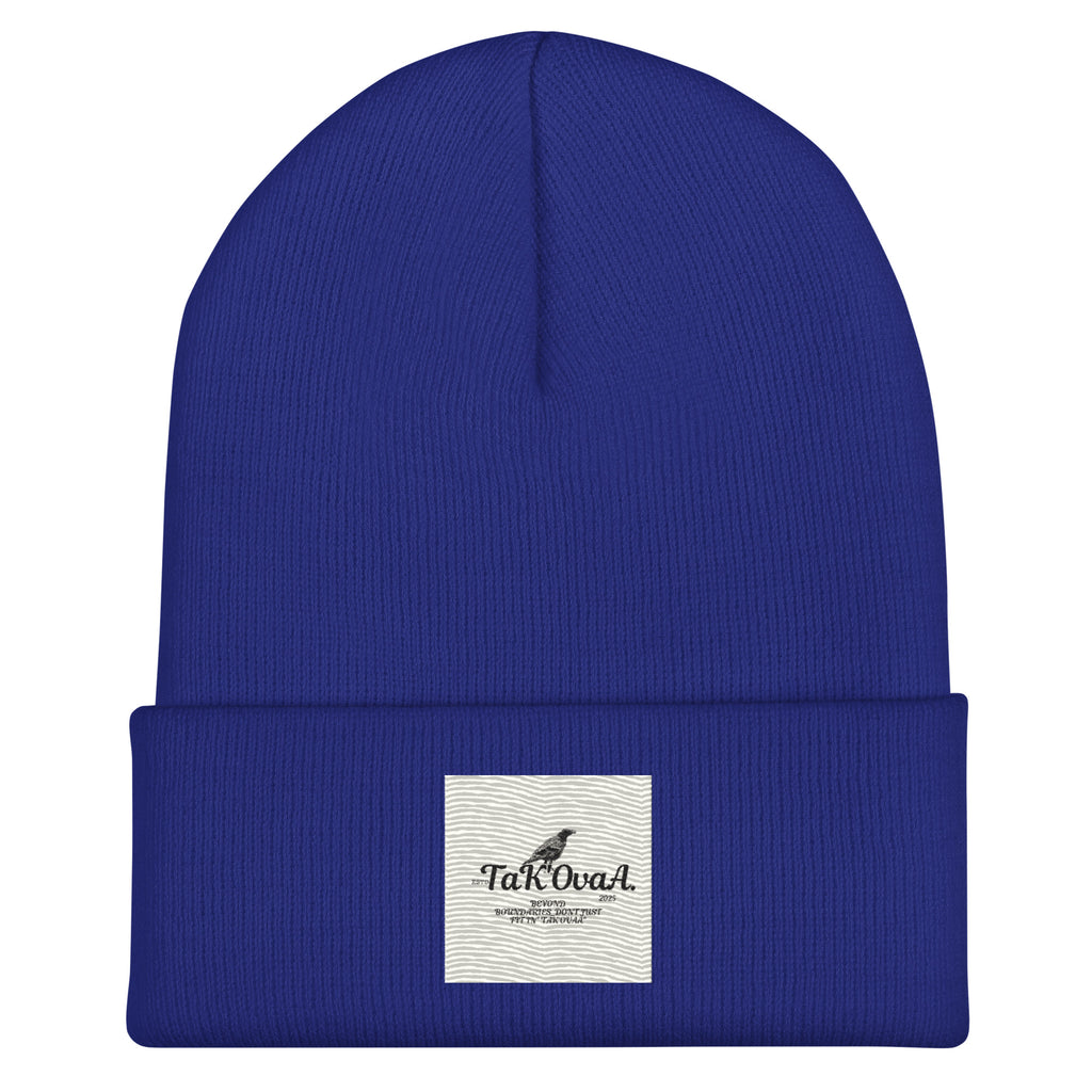 Blue beanie with a white label on a white background