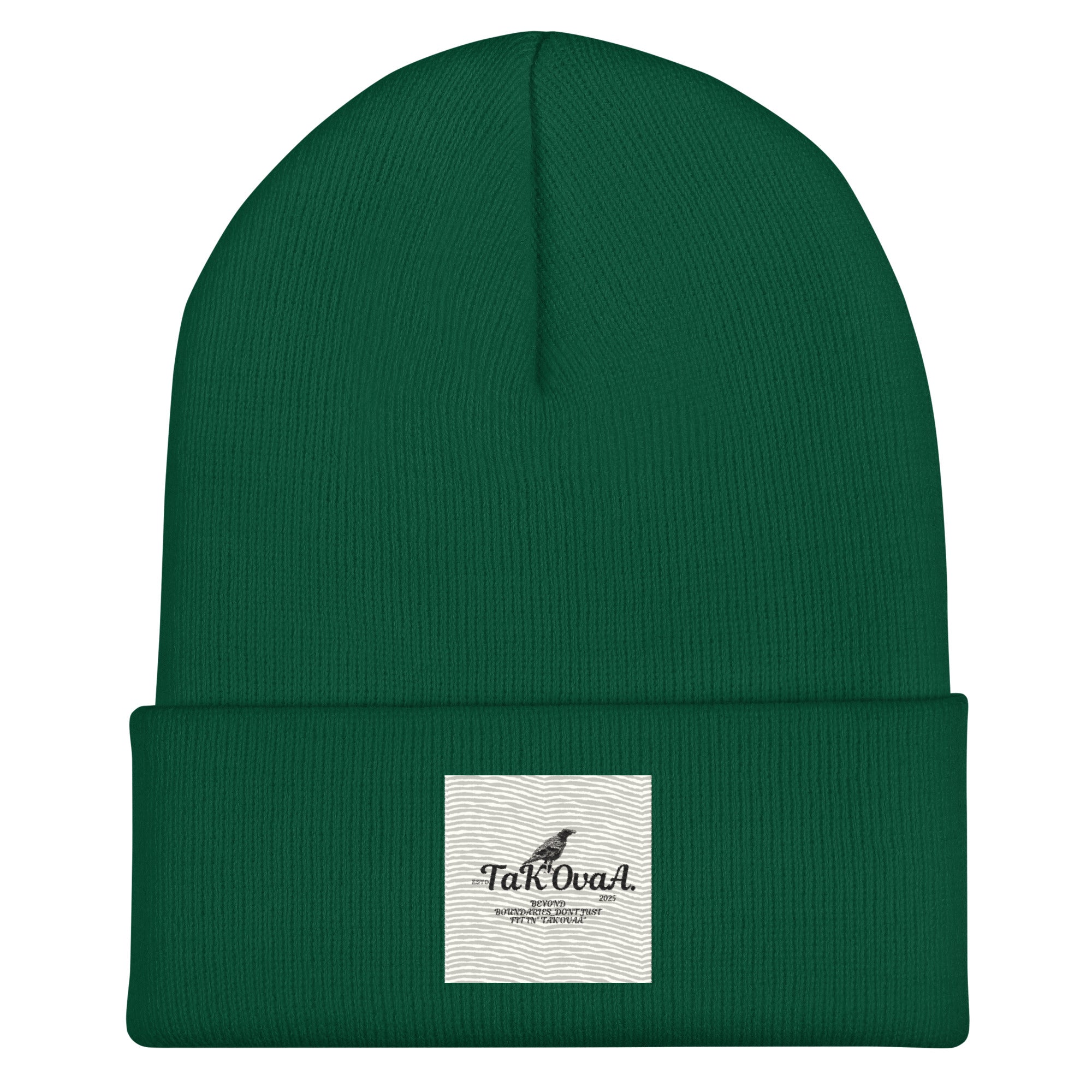 Green beanie with a white label on a white background