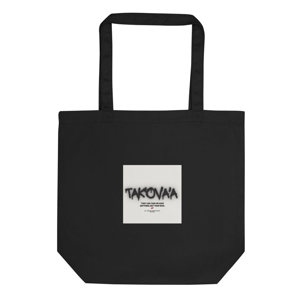 Black tote bag with a white square featuring text on a white background