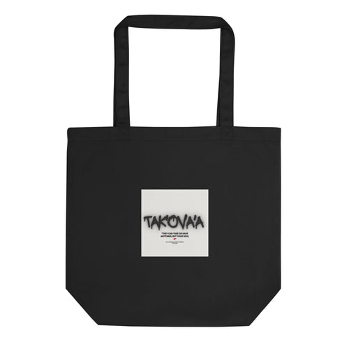 Black tote bag with a white square featuring text on a white background
