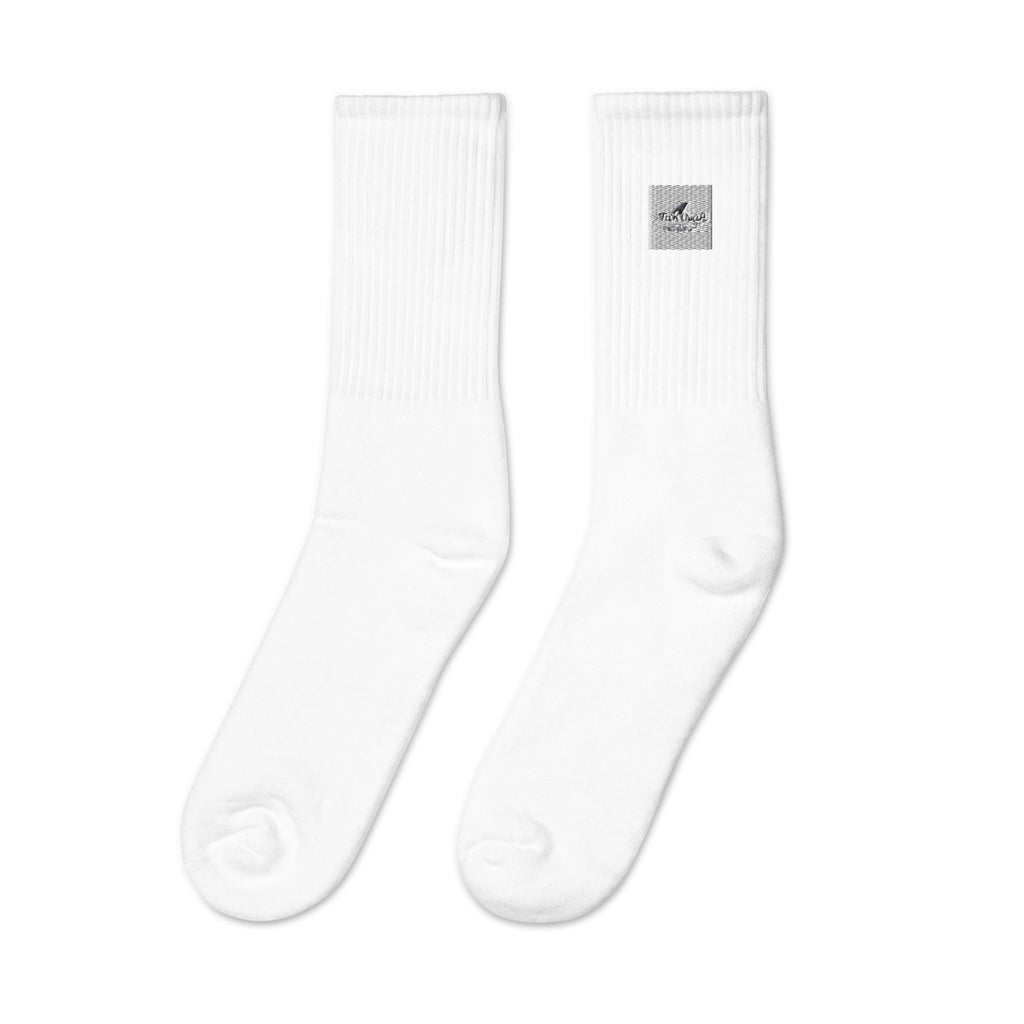 White socks with a small logo on a white background