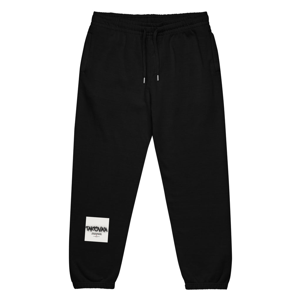 Black sweatpants with a small white label on a white background