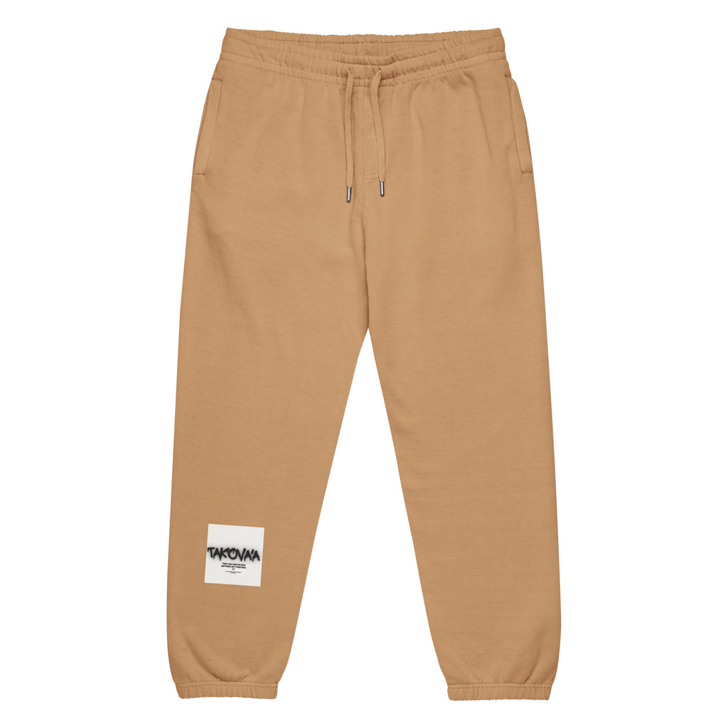 Features a Sandstone colorway and often includes graphic prints on the back leg or hip.