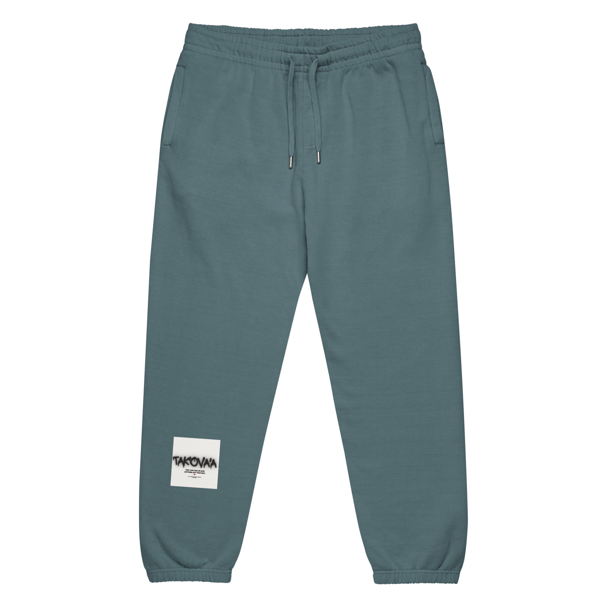 Teal sweatpants with a brand label on a white background