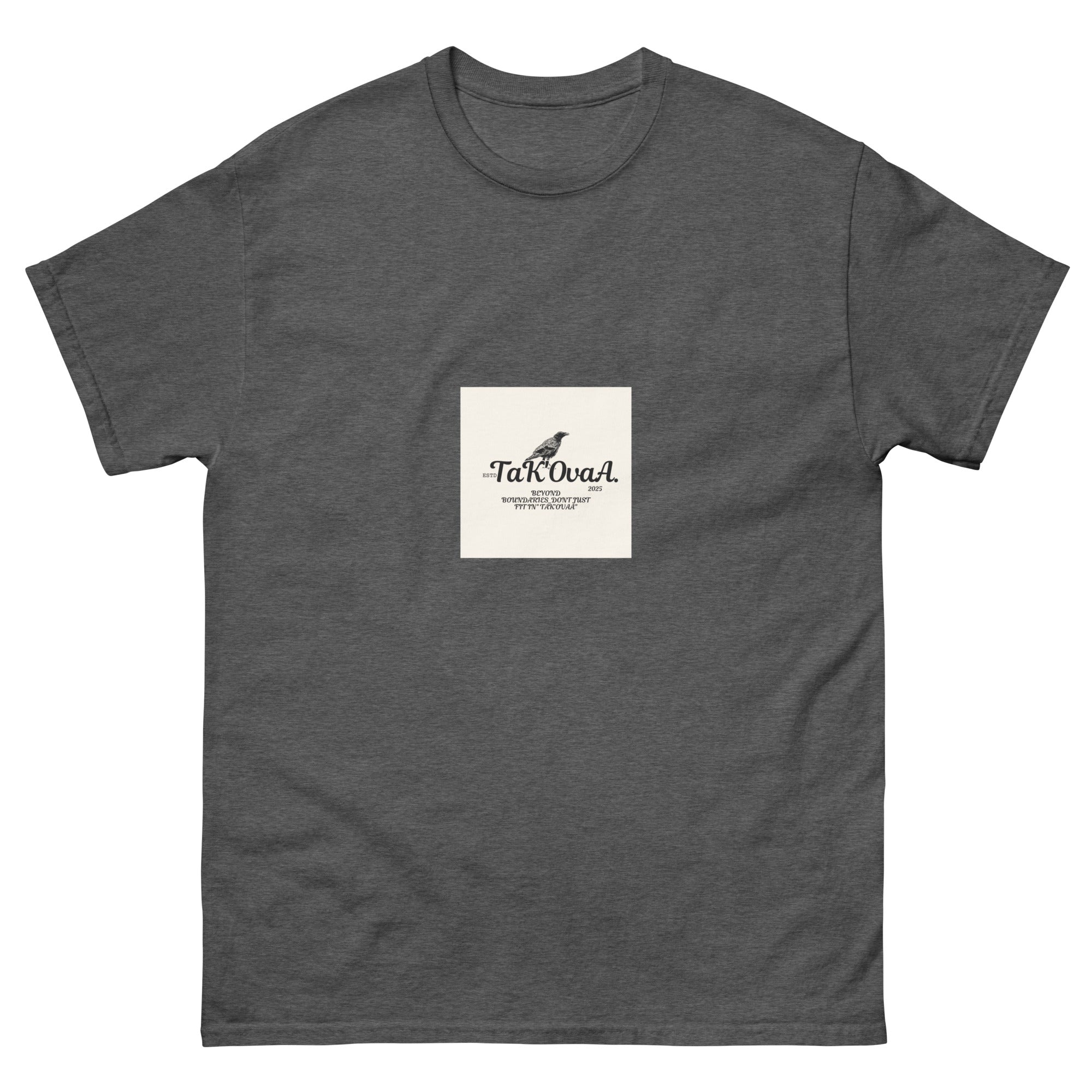 Gray t-shirt with a small white square logo featuring text and a bird illustration on a white background.