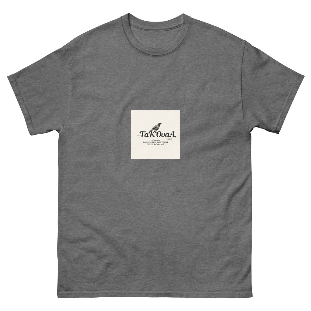 Gray t-shirt with a small white square logo featuring text and a bird illustration on a white background