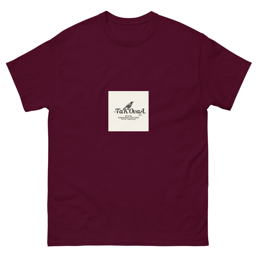 Maroon t-shirt with a white square featuring text and a logo on a white background