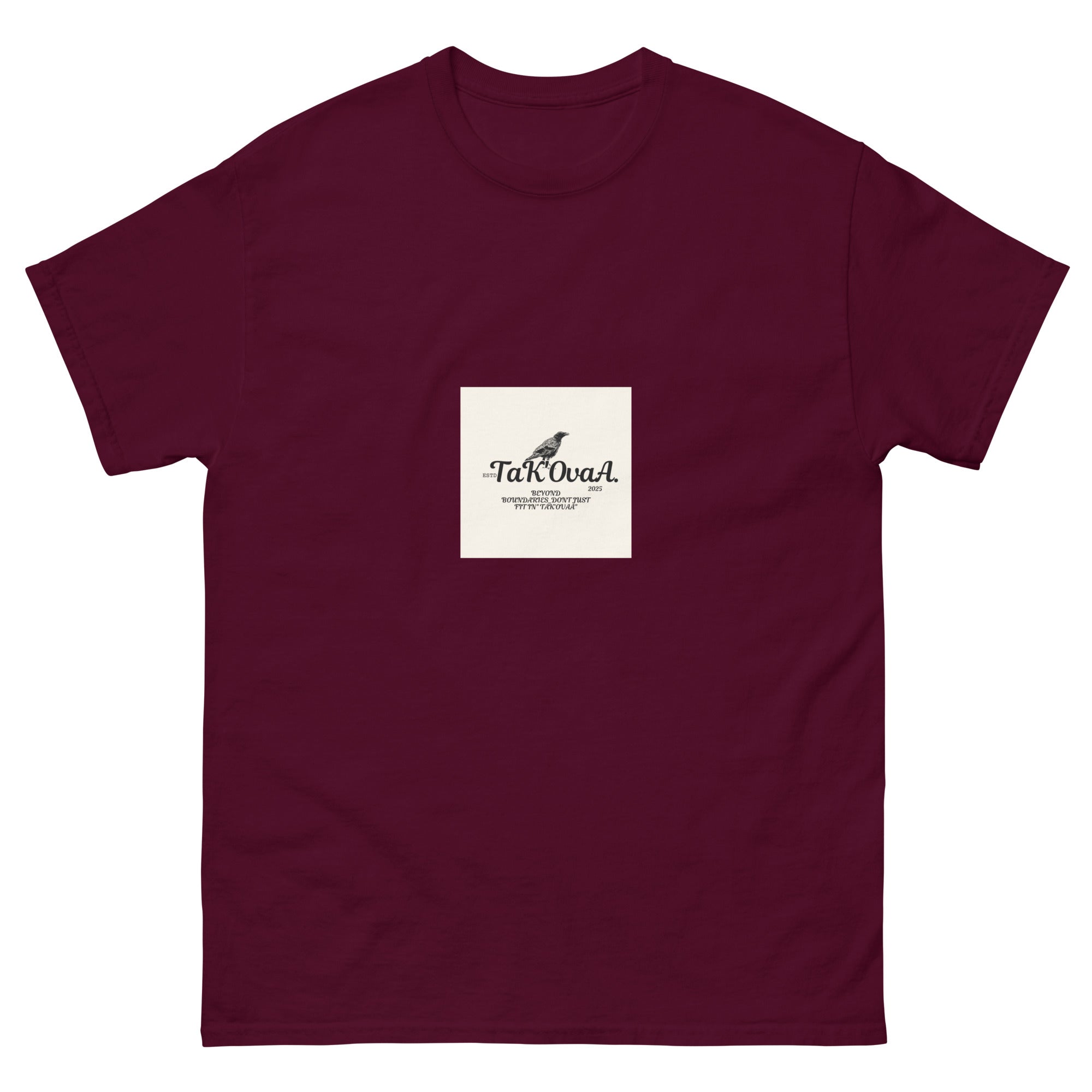 Maroon t-shirt with a white square featuring text and a logo on a white background