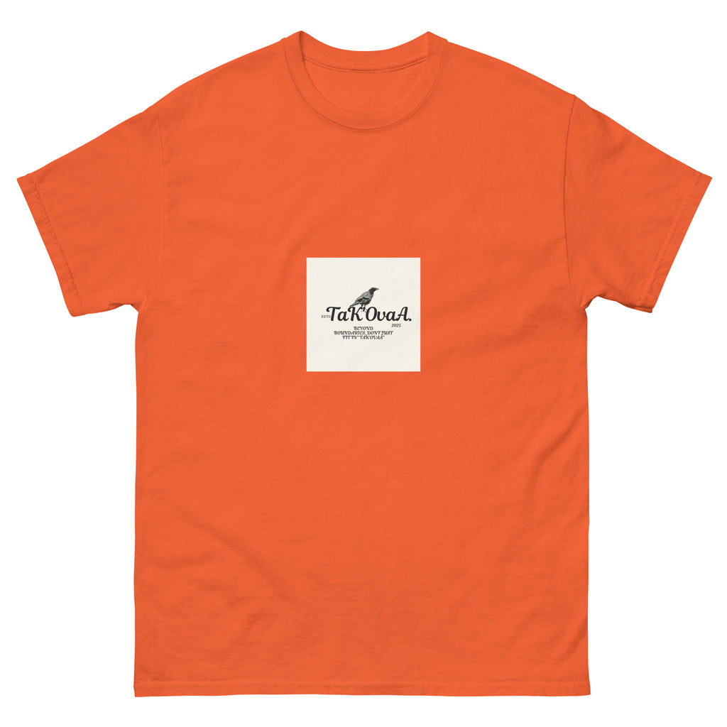 Orange t-shirt with a white label featuring text and a logo on a white background