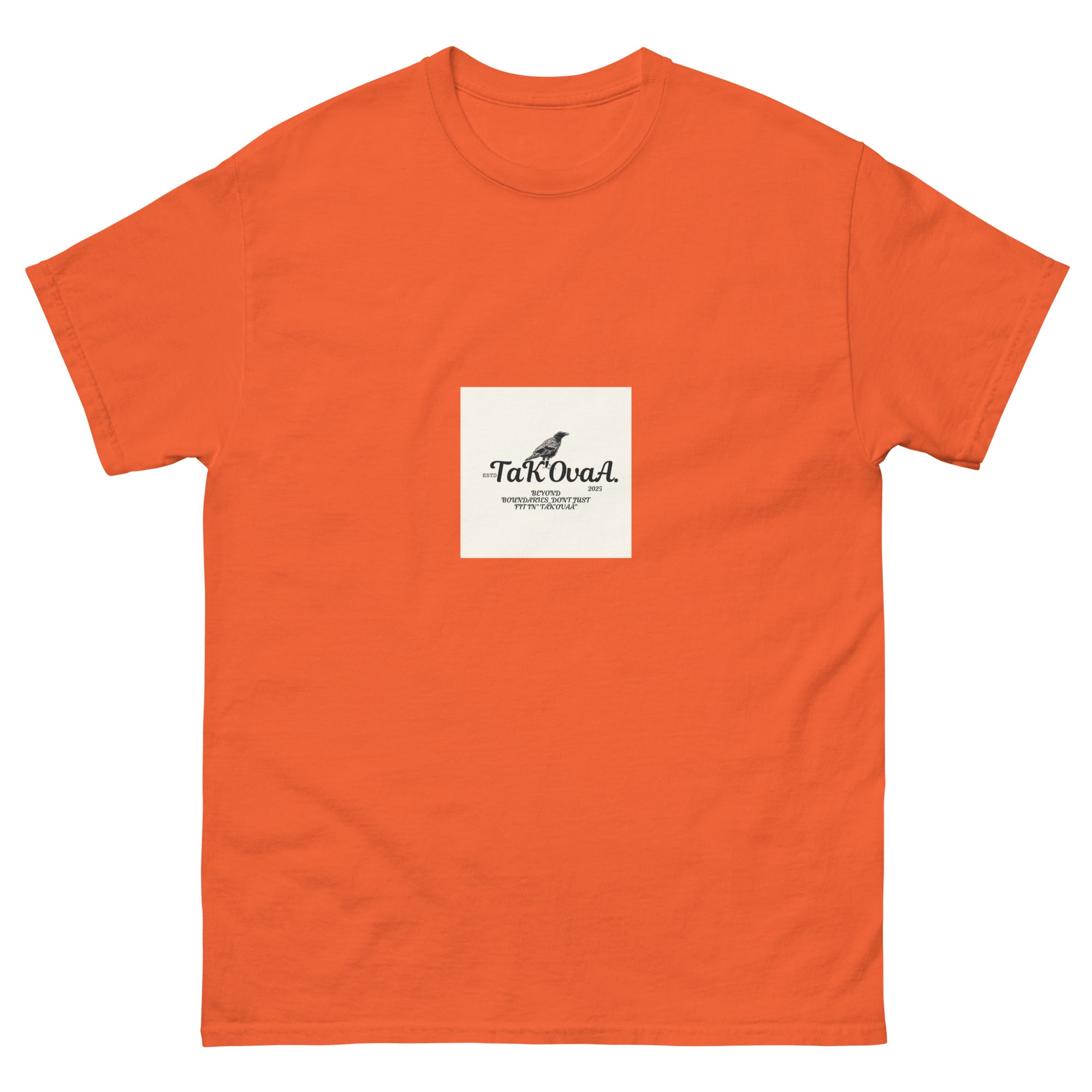 Orange t-shirt with a white label featuring text and a logo on a white background