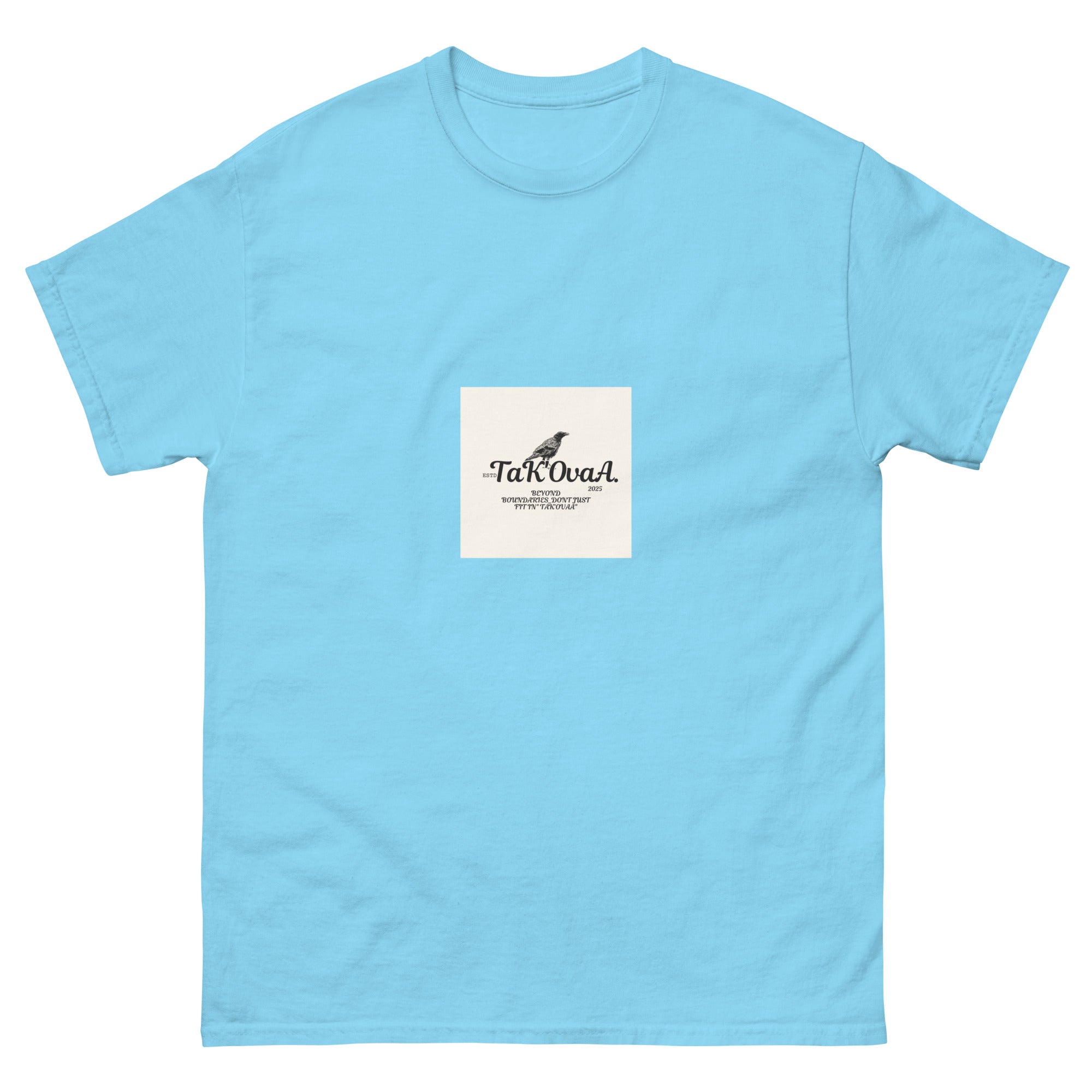 Light blue t-shirt with a small white square logo featuring text and a graphic on a white background