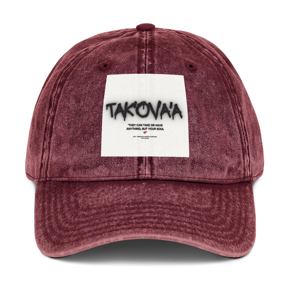 Maroon cap with a white patch featuring text on a white background