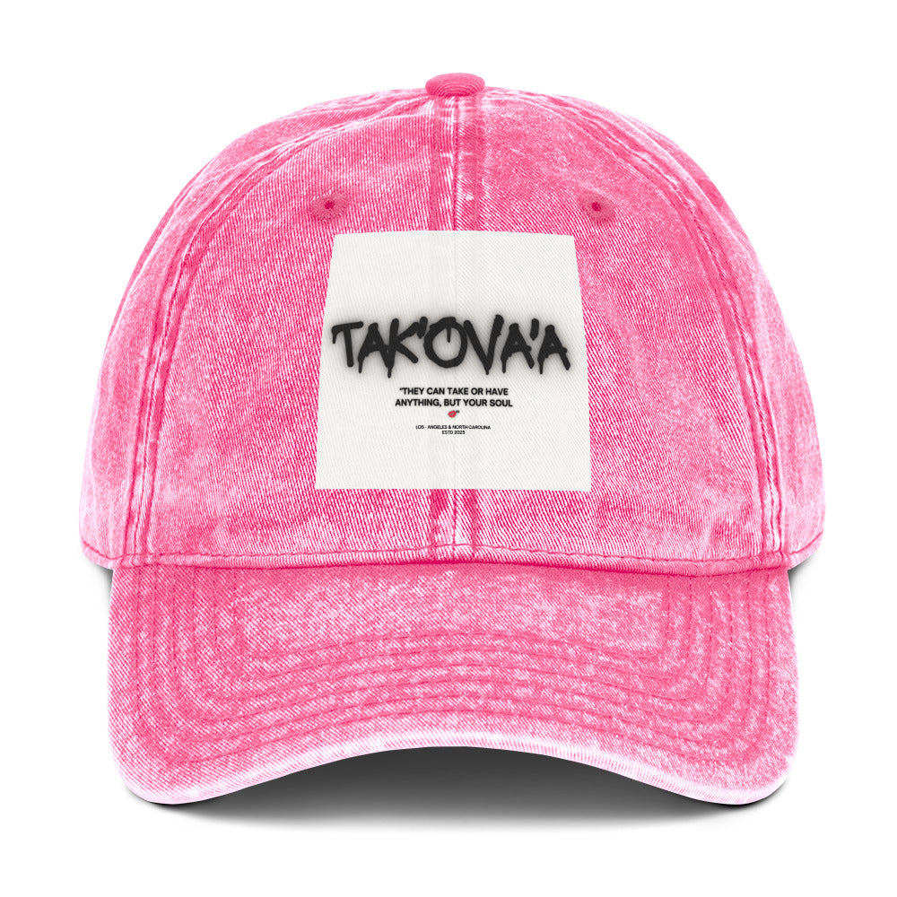 Pink cap with a white patch featuring text on a white background