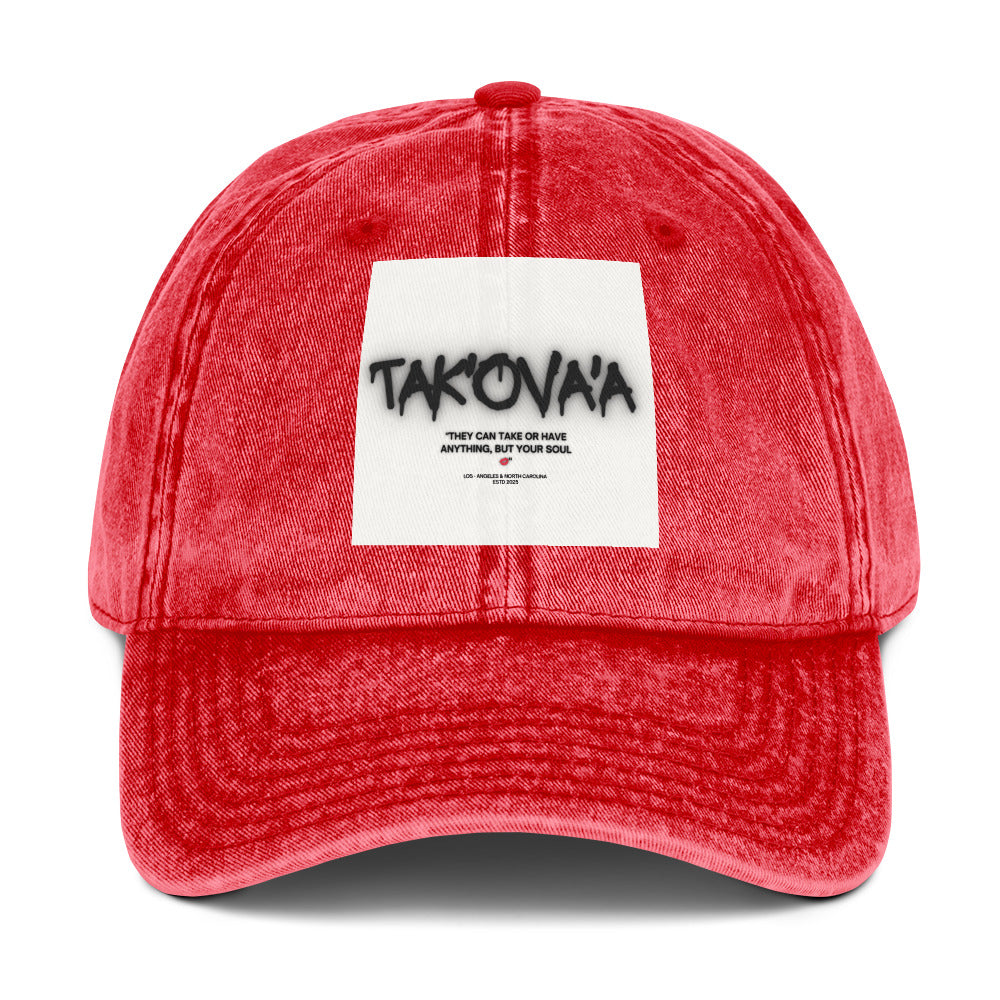 Red denim cap with a white label featuring text on a white background